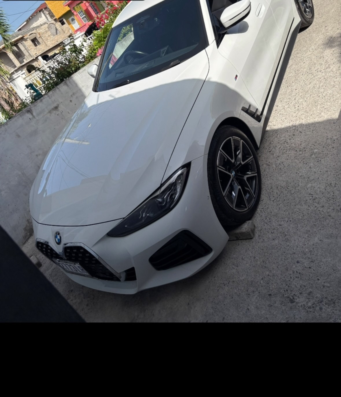 A white BMW 420i in for rear brake pads