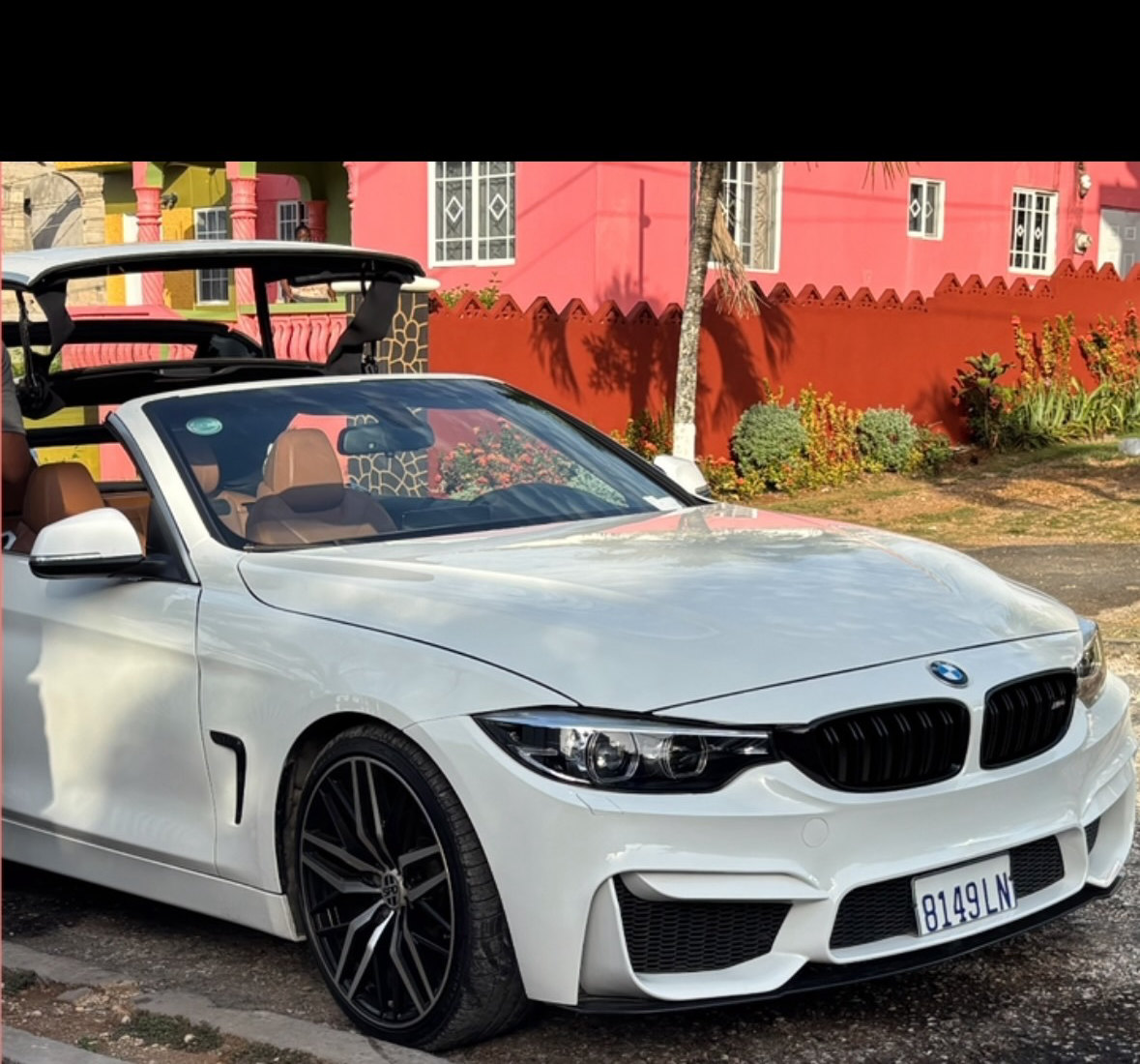 A white BMW 4 Series convertible at JRC Automotive